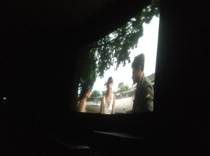 Alex Chevasco, Hannah Croft and Kristina Gren on the screen of the Cinemateket's Victor theatre in En Attendant Godard.