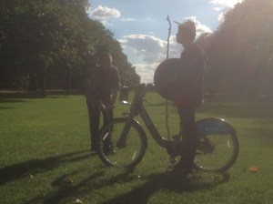 Dennis and Hadrian Gutt stand in silhouette in Hyde Park.